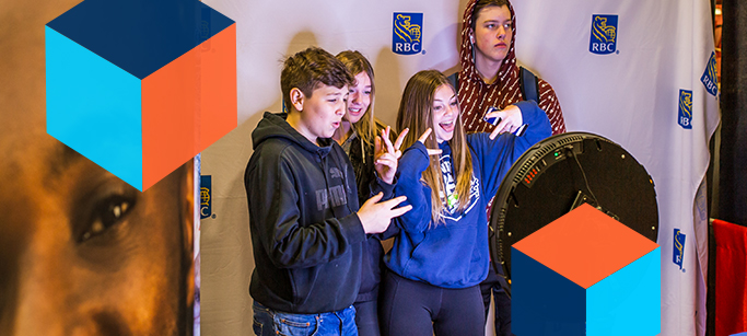 A group of youth, posing for pictures at a booth at the Skills Canada Career Showcase